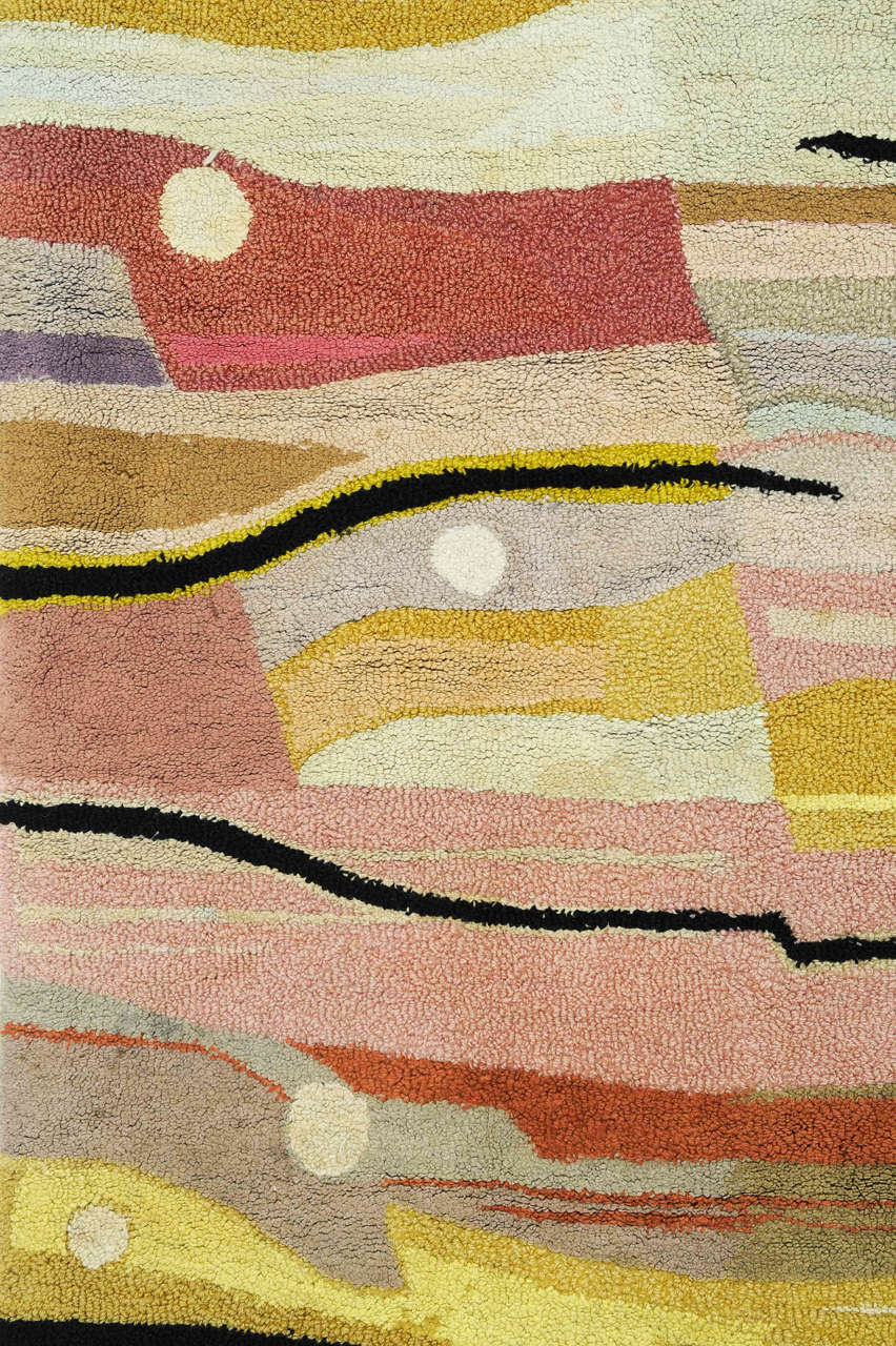 A rare and unusual rug distinguished by an abstract pattern of stylized waves in different shades typical of the work of the Bauhaus school. The weave is quite different what we normally encounter and consists of a sort of hooked technique on a